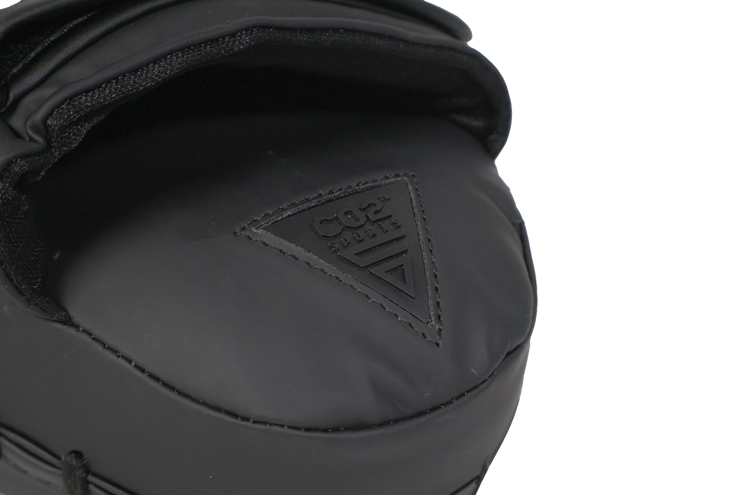 Close-up of a black helmet with a logo on a white background