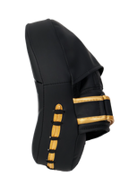 Black glove with gold accents on a white background