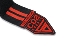 Black and red sports strap with visible branding on a white background