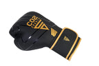 Black boxing glove with gold accents on a white background