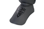 Black shin guard with 'CO2 Sports' branding on a white background
