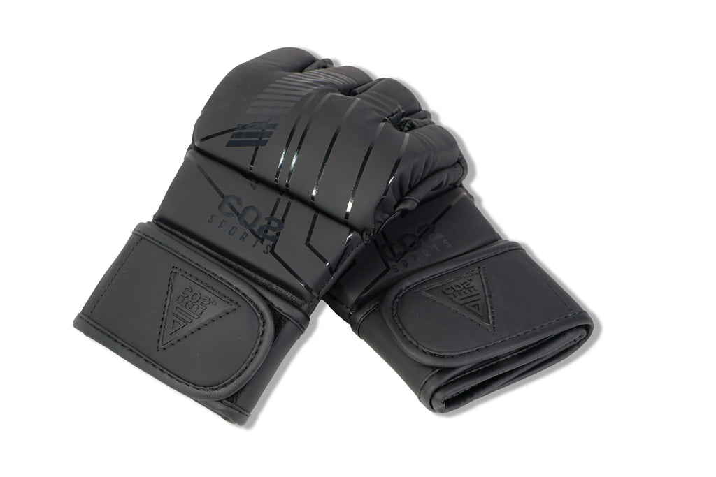 Flat lay of CO2 Sports black MMA gloves showing padded knuckles and wrist strap
